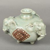 A Chinese porcelain celadon glazed vase Of squat form with elephant mask handles,