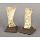 A pair of 19th century Central European carved bone vases One worked with a huntsman,
