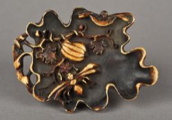 A Chinese carved brush washer Of shallow leaf form, decorated with insects and fruit. 10.5 cm wide.