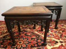 A pair of 19th century Chinese carved hardwood urn stands Each cleated rectangular top above a