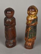 A pair of antique carved wood and polychrome decorated figures,