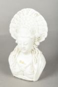 A Chinese blanc de chine porcelain bust of Guanyin Modelled wearing an elaborate headdress. 17.