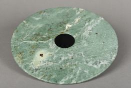 A jade bi disc Of typical form. 28.25 cm diameter.