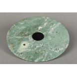 A jade bi disc Of typical form. 28.25 cm diameter.