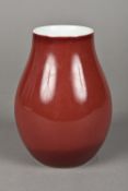 A Chinese porcelain sang de boeuf glazed vase Of baluster form,