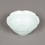 A Chinese porcelain lotus bowl The interior worked with a mythical beast and with allover celadon