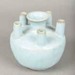A Chinese porcelain flower vase The lappet moulded body issuing six spouts. 11 cm high.