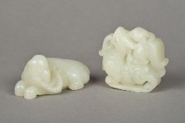 A Chinese carved celadon jade elephant Modelled recumbent;
