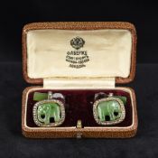 A pair of Russian diamond and jade set gold cufflinks Each fronted with a carved jade elephant in a