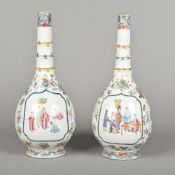 A pair of 19th century Canton famille rose porcelain bottle vases Each with faux bamboo banded