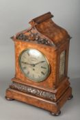 A Victorian walnut cased mantel clock by W C Bennett,