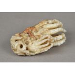 A large Chinese carved celadon and russet jade group Worked as Buddha's fingers. 13.5 cm long.