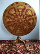 A George III oak tilt-top tripod table Of circular form,