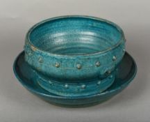A Chinese porcelain bowl and stand, possibly Ming Both with allover turquoise glaze,