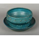 A Chinese porcelain bowl and stand, possibly Ming Both with allover turquoise glaze,