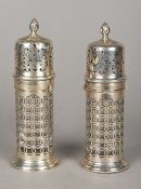 A matched pair of Edwardian pierced silver sugar sifters, one hallmarked London 1903,