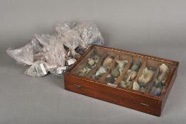 A specimen mineral collection Some housed in a glazed mahogany display case. The case 40 cm wide.
