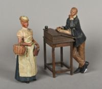 A 19th century German painted terracotta figural group Formed as a housemaid and a gentleman