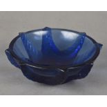 A small Lalique blue glass bowl The underside inscribed Lalique France. 11 cm diameter.