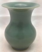 A Chinese porcelain vase With allover green glaze, blue painted six character Wanli mark to base.