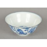 A Chinese blue and white porcelain bowl The interior decorated with three scholarly figures,