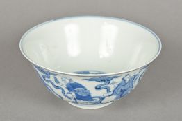 A Chinese blue and white porcelain bowl The interior decorated with three scholarly figures,