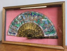 A 19th century Canton painted and lacquered fan Decorated with figures in various pursuits,