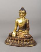 A Tibetan gilt bronze figure of Buddha Typically modelled. 13 cm high.