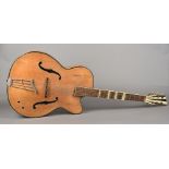 A 1950s Rolyford acoustic guitar Of typical form. 108 cm long.