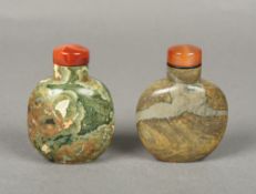 Two Chinese carved hardstone snuff bottles and stoppers Both 7.5 cm high.