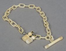 A 19th century carved ivory Albert chain Of typical form. 32 cm long.