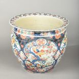 A Japanese porcelain jardiniere Decorated in the Imari palette. 31.5 cm high.