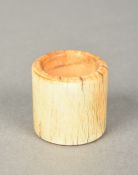 A Chinese carved ivory archer's ring 3 cm diameter.