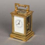 A 19th century French lacquered brass cased repeating carriage clock Of rectangular stepped and