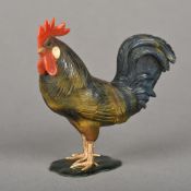 A gold mounted coral and hardstone model of a cockerel Modelled standing, with glass inset eyes. 9.