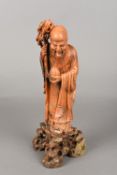 A Chinese carved soapstone figure of Shou Lao Typically modelled with staff and peach,