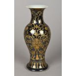 A Chinese porcelain vase The black ground with gilt scrolling floral decoration,