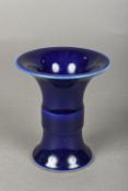 A Chinese porcelain Gu vase With allover blue glaze,