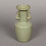 A Chinese porcelain crackle glaze twin handled vase With allover celadon glaze,
