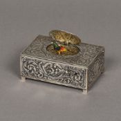 A 19th century Continental 800 silver cased singing bird box The case with embossed scrolling