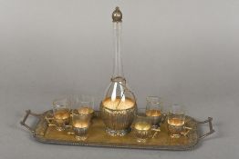 A Continental 800 silver gilt and glass liqueur set Comprising: a twin handled serving tray,