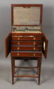 An early 20th century silver fitted mahogany cutlery canteen on stand,