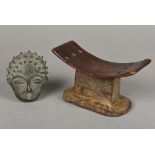 A South African carved wood headrest, together with an African bronze mask The former 19 cm wide.