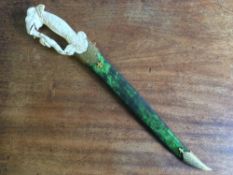 An Indian gilt decorated and ivory handled dagger The patterned steel wavy blade with Mughal