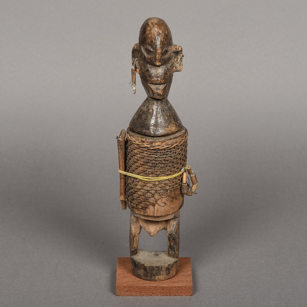 A late 19th/early 20th century African carved wood figural vessel, probably Dogon Tribe, Mali,