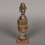 A late 19th/early 20th century African carved wood figural vessel, probably Dogon Tribe, Mali,