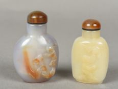 Two Chinese carved agate snuff bottles and stoppers Both figurally carved. 7.