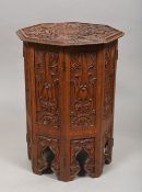 A Victorian carved and hinged octagonal coffee table of Moorish design,