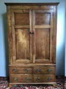 A 19th century French fruitwood armoire The moulded cornice above the twin panelled doors enclosing