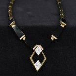 An Art Deco style 14K gold,